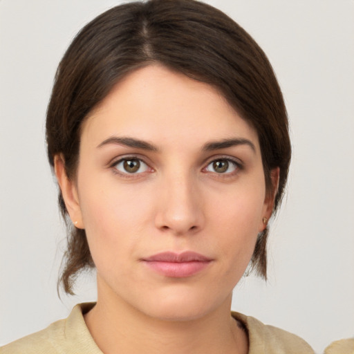 Neutral white young-adult female with medium  brown hair and brown eyes