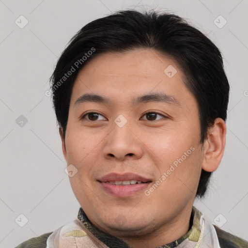 Joyful asian young-adult male with short  brown hair and brown eyes