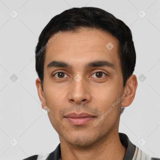 Neutral latino young-adult male with short  black hair and brown eyes