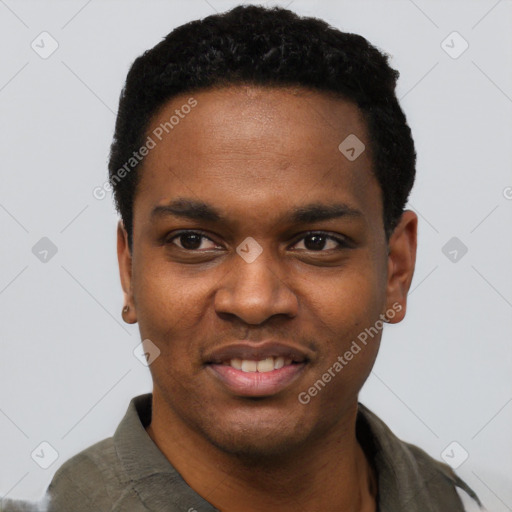 Joyful black young-adult male with short  black hair and brown eyes