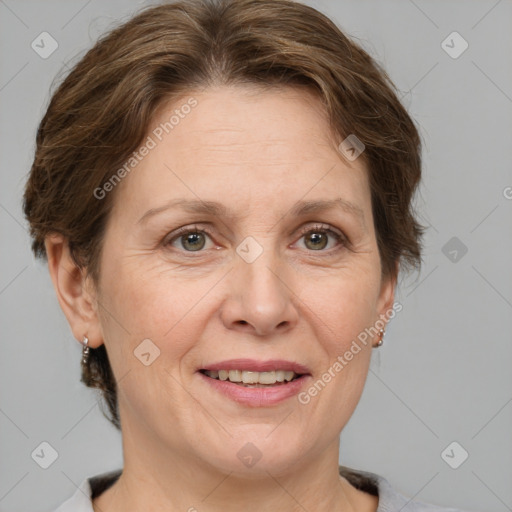 Joyful white adult female with medium  brown hair and grey eyes