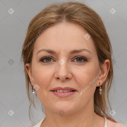 Joyful white adult female with medium  brown hair and grey eyes