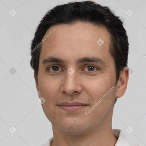 Joyful white adult male with short  brown hair and brown eyes