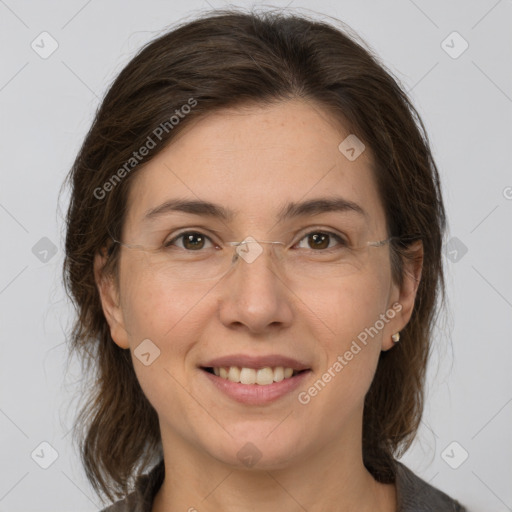 Joyful white adult female with medium  brown hair and grey eyes