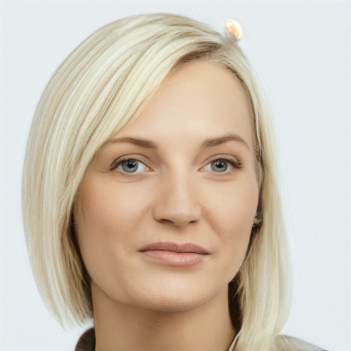 Joyful white young-adult female with long  brown hair and blue eyes