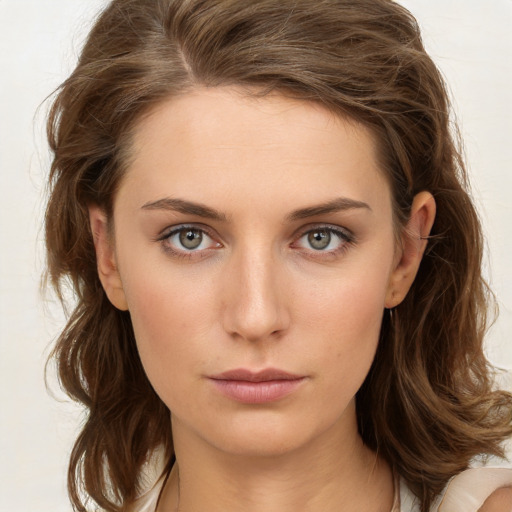 Neutral white young-adult female with medium  brown hair and green eyes