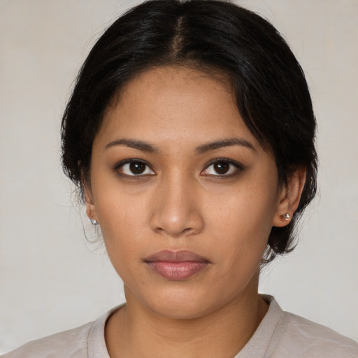 Neutral latino young-adult female with medium  black hair and brown eyes