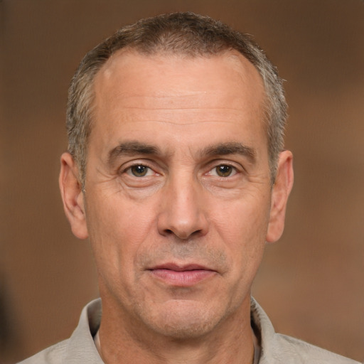 Joyful white middle-aged male with short  brown hair and brown eyes