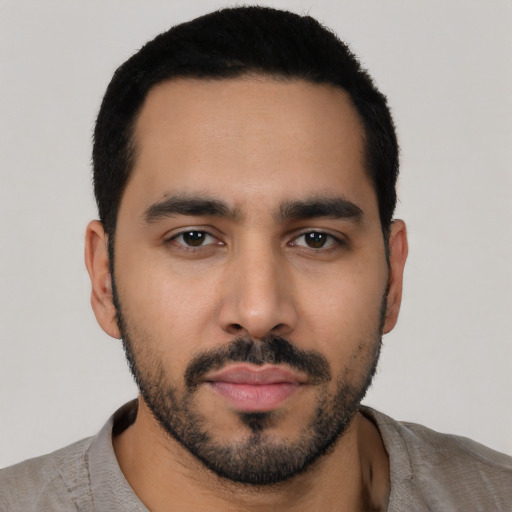 Neutral latino young-adult male with short  black hair and brown eyes
