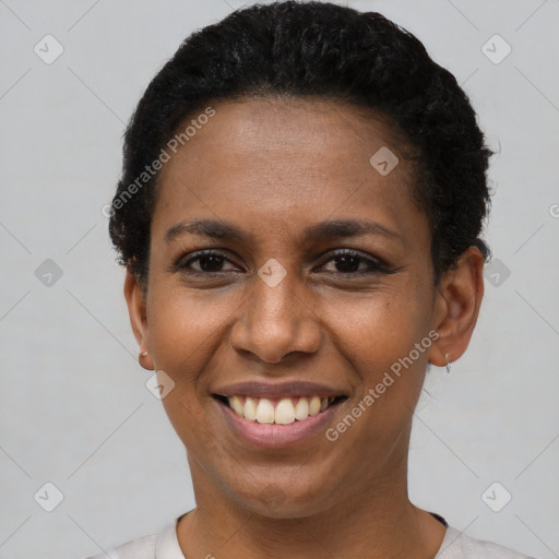 Joyful black young-adult female with short  black hair and brown eyes