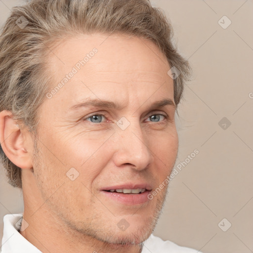 Joyful white adult male with short  brown hair and grey eyes