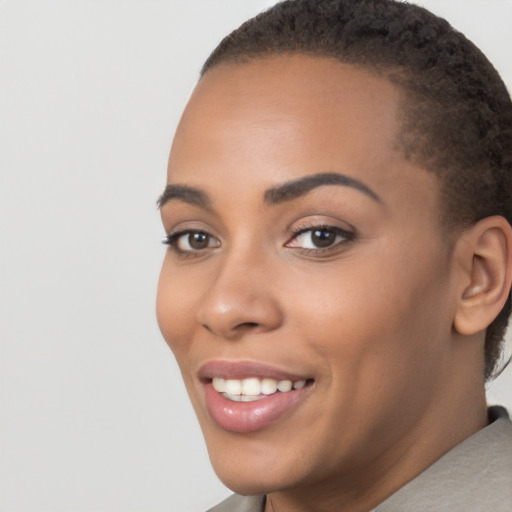 Joyful latino young-adult female with short  brown hair and brown eyes