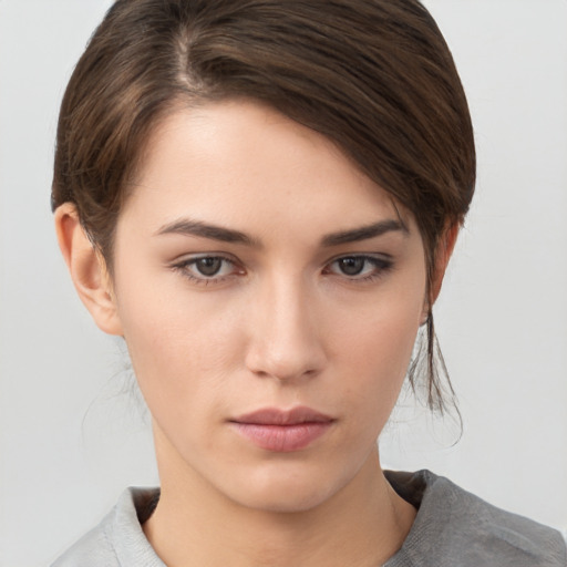 Neutral white young-adult female with medium  brown hair and brown eyes