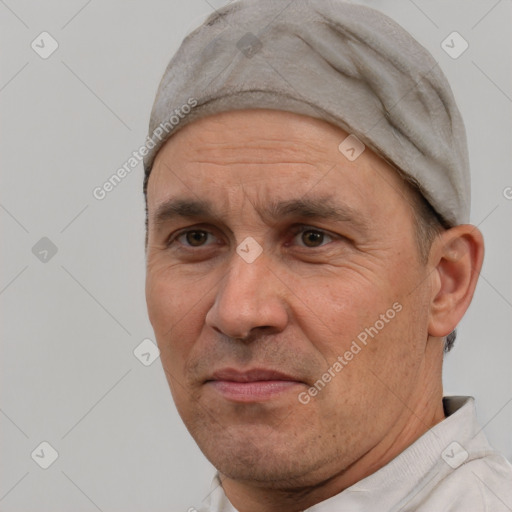 Joyful white adult male with short  black hair and brown eyes