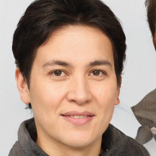 Joyful white adult male with medium  brown hair and brown eyes