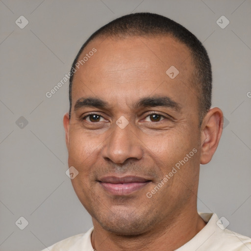 Joyful latino adult male with short  black hair and brown eyes