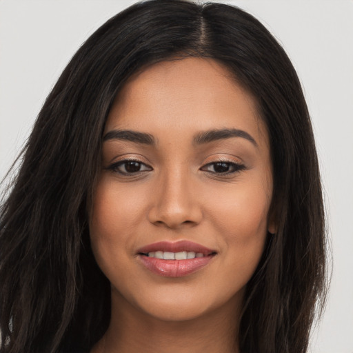 Joyful asian young-adult female with long  brown hair and brown eyes