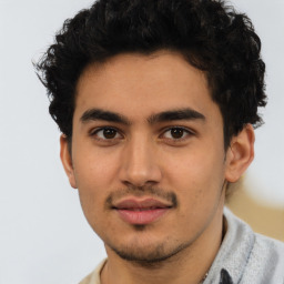 Joyful latino young-adult male with short  brown hair and brown eyes