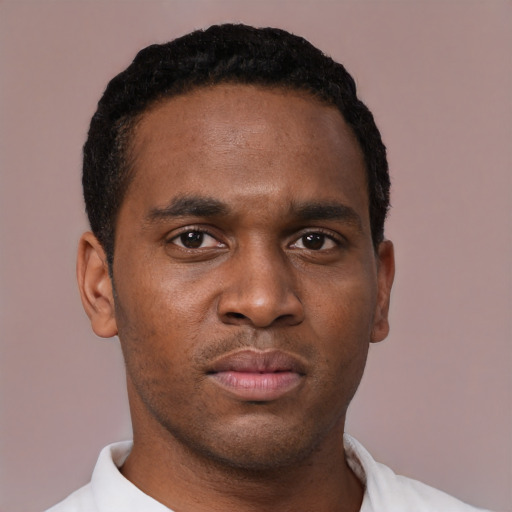 Neutral black young-adult male with short  black hair and brown eyes
