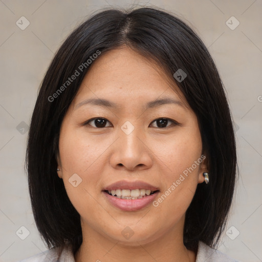 Joyful asian young-adult female with medium  brown hair and brown eyes