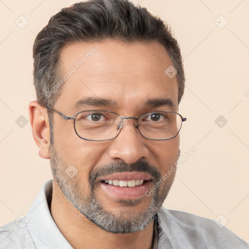 Joyful white adult male with short  black hair and brown eyes