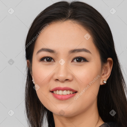Joyful white young-adult female with long  brown hair and brown eyes