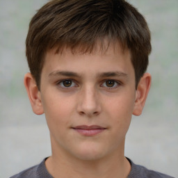 Joyful white child male with short  brown hair and brown eyes