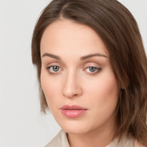 Neutral white young-adult female with medium  brown hair and green eyes