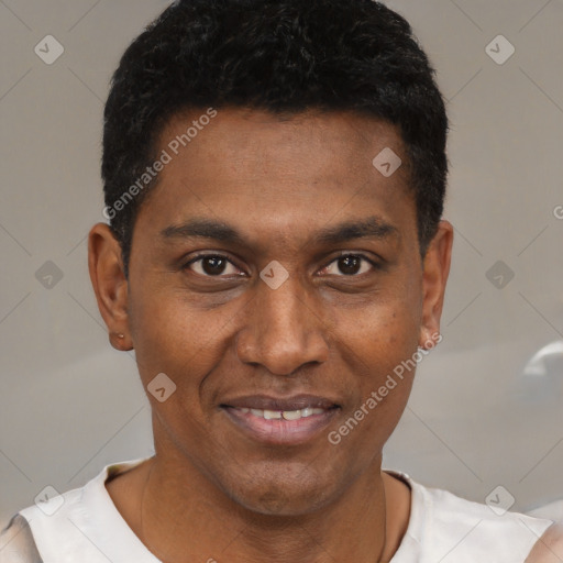 Joyful black young-adult male with short  black hair and brown eyes