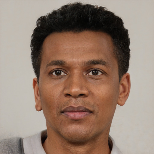 Neutral black adult male with short  black hair and brown eyes