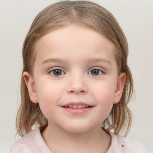 Joyful white child female with medium  brown hair and grey eyes