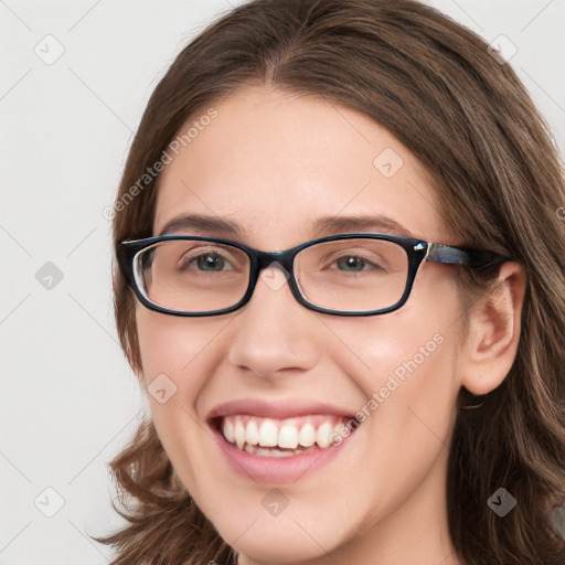 Joyful white young-adult female with long  brown hair and blue eyes