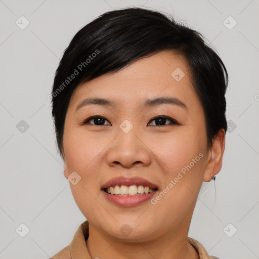 Joyful asian young-adult female with short  black hair and brown eyes