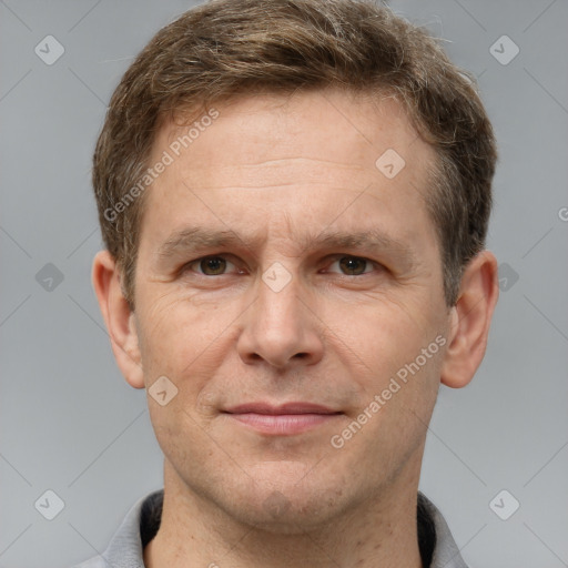 Joyful white adult male with short  brown hair and grey eyes