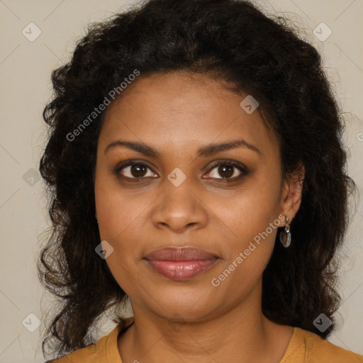 Joyful black young-adult female with long  brown hair and brown eyes