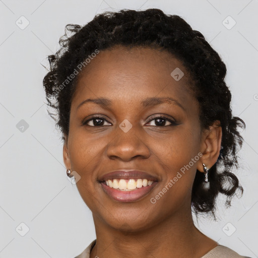 Joyful black young-adult female with medium  black hair and brown eyes