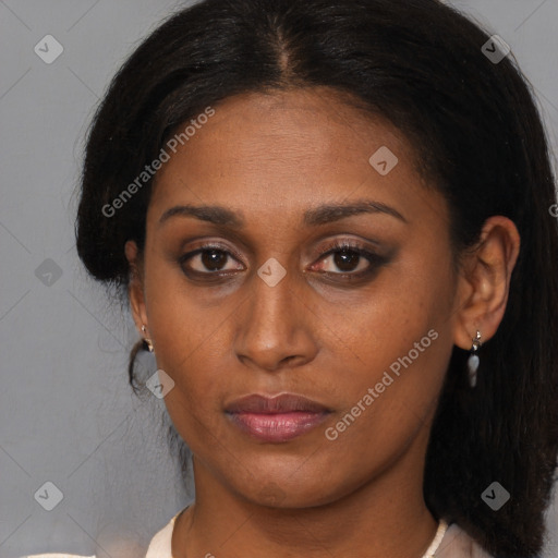 Joyful latino young-adult female with medium  brown hair and brown eyes