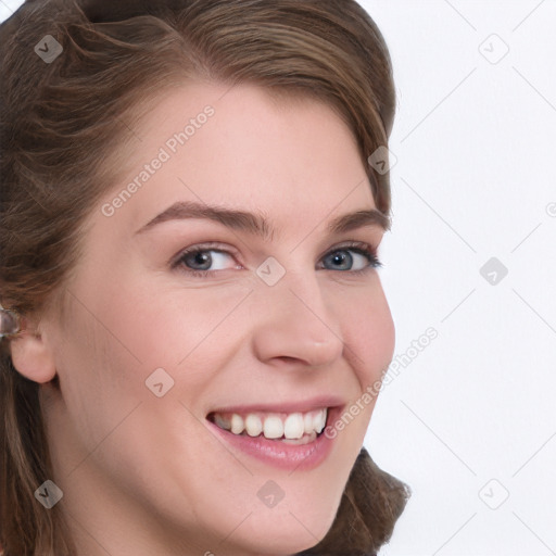 Joyful white young-adult female with long  brown hair and blue eyes