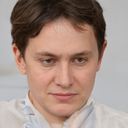 Joyful white adult male with short  brown hair and grey eyes