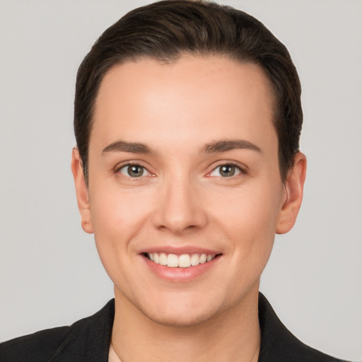 Joyful white young-adult female with short  brown hair and brown eyes