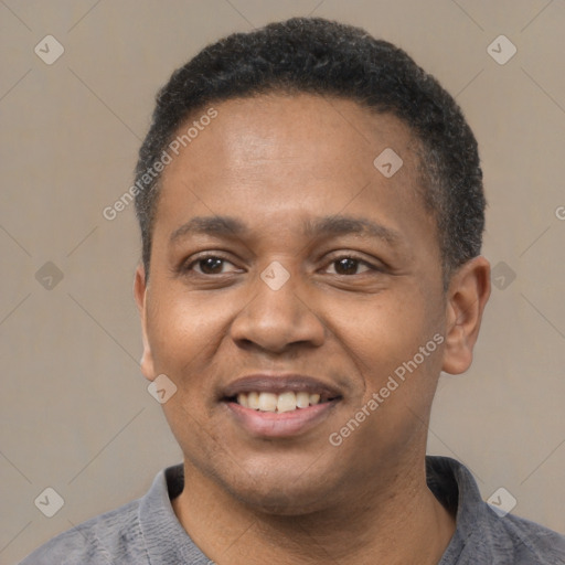 Joyful latino adult male with short  black hair and brown eyes