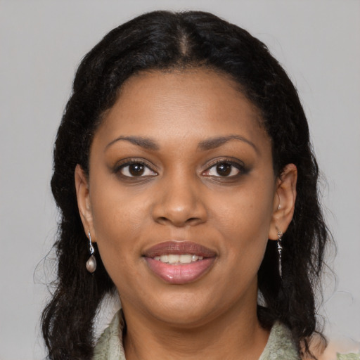 Joyful black young-adult female with medium  black hair and brown eyes