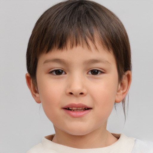 Joyful white child female with short  brown hair and brown eyes