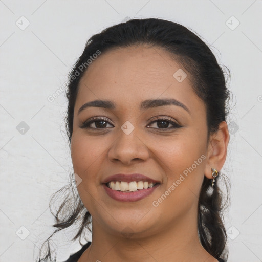 Joyful latino young-adult female with long  brown hair and brown eyes