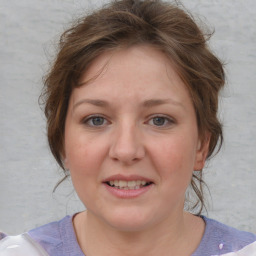 Joyful white young-adult female with medium  brown hair and blue eyes