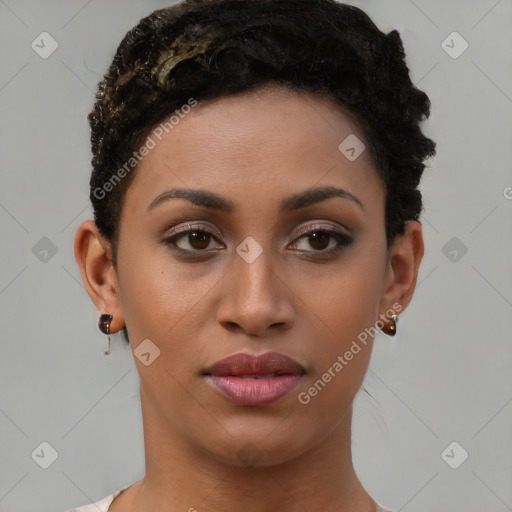 Joyful black young-adult female with short  brown hair and brown eyes