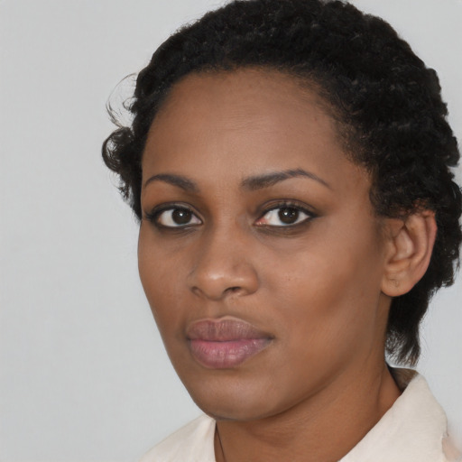 Neutral black young-adult female with short  black hair and brown eyes