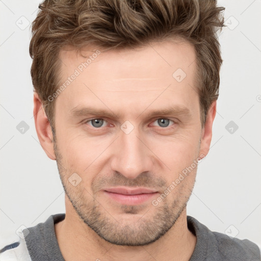 Joyful white adult male with short  brown hair and grey eyes