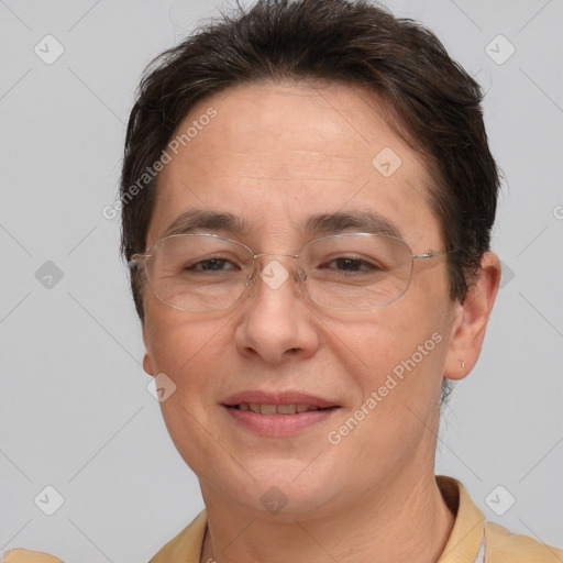 Joyful white adult female with short  brown hair and brown eyes