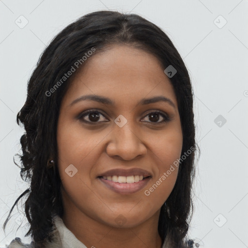Joyful black young-adult female with long  brown hair and brown eyes